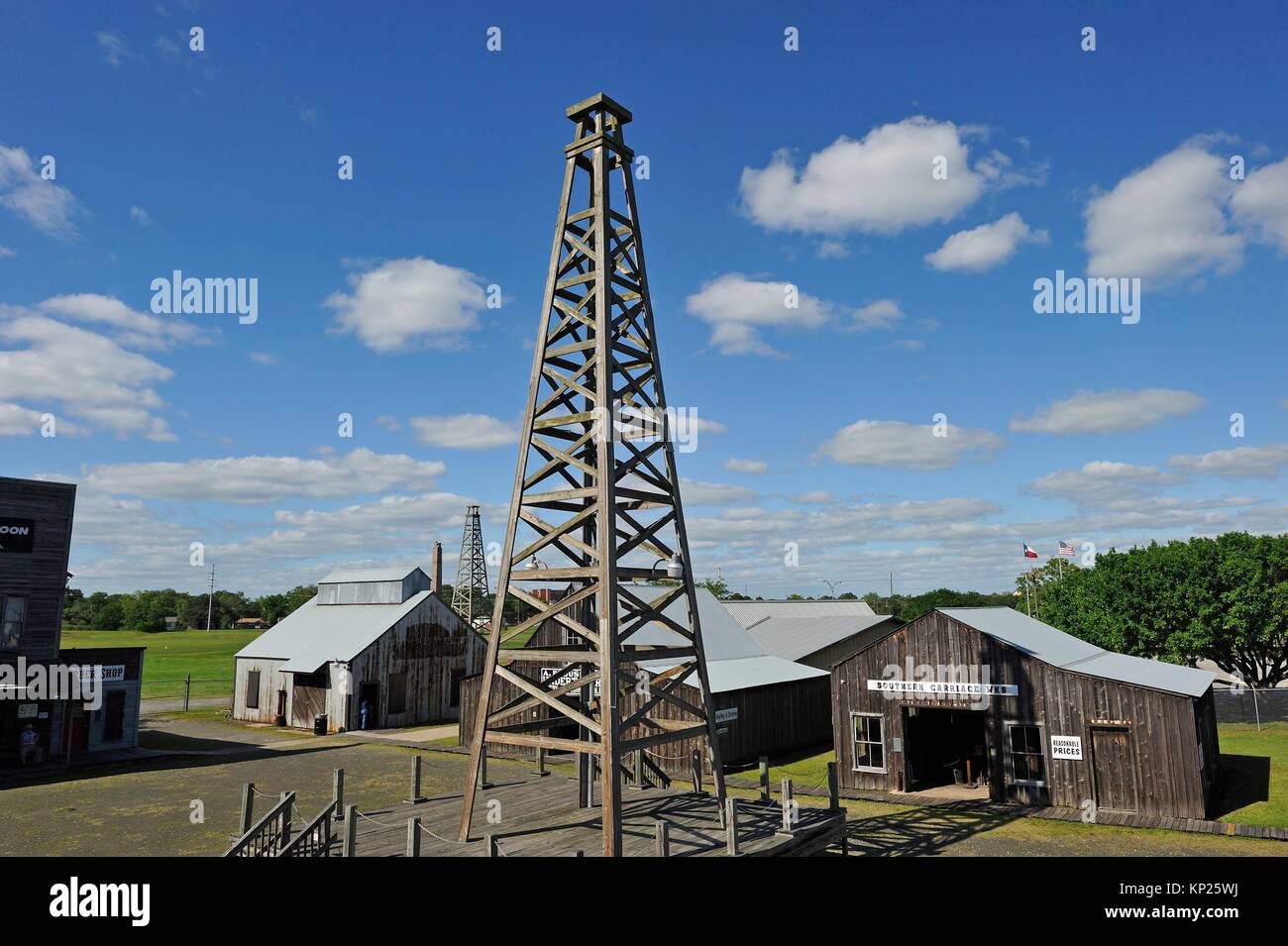 The Spindletop-Gladys City Boomtown Museum that features an oil derrick and many reconstructed Gladys City building interiors furnished with Stock Photo
