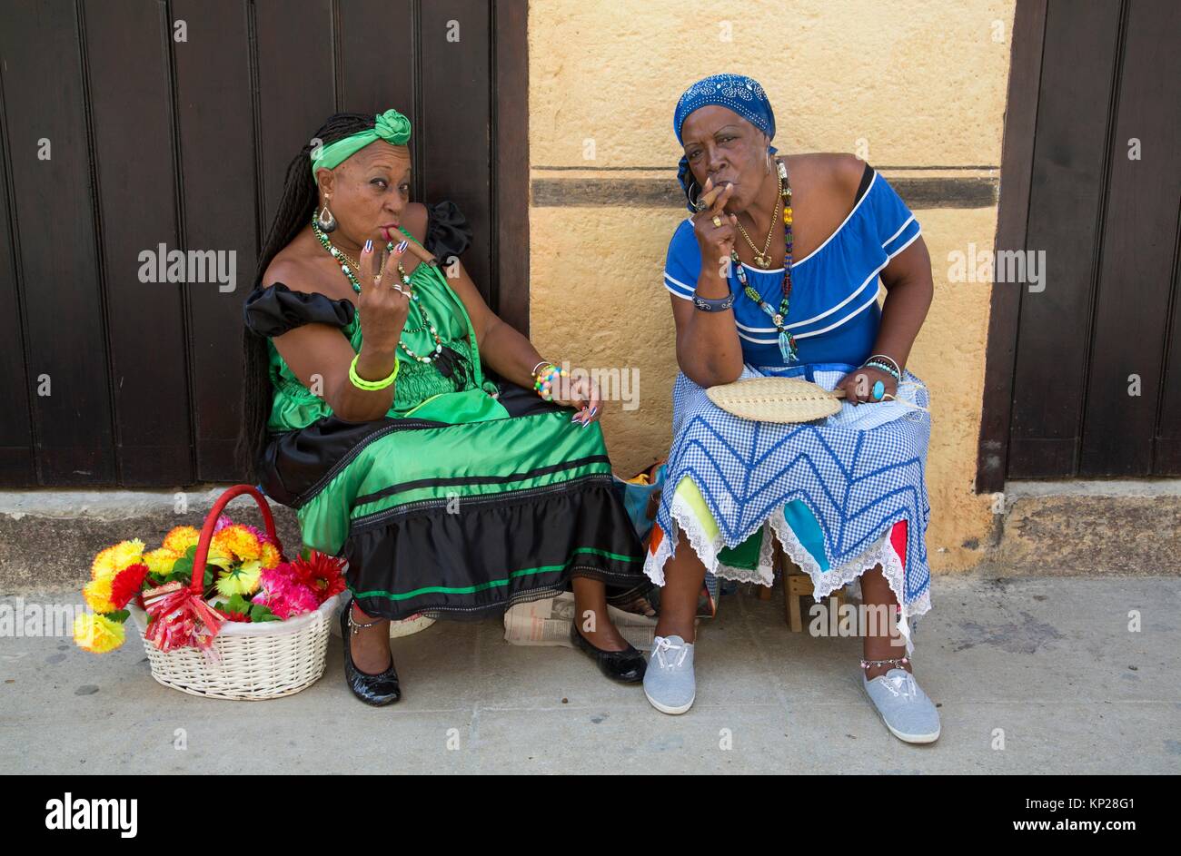 Local Women Smoking Cigars, La Habana Vieja, UNESCO World Heritage Site, Havana, Cuba Stock Photo
