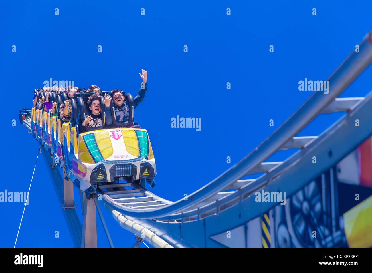 people taking a ride in a fairground attraction in Tenerife island Stock Photo