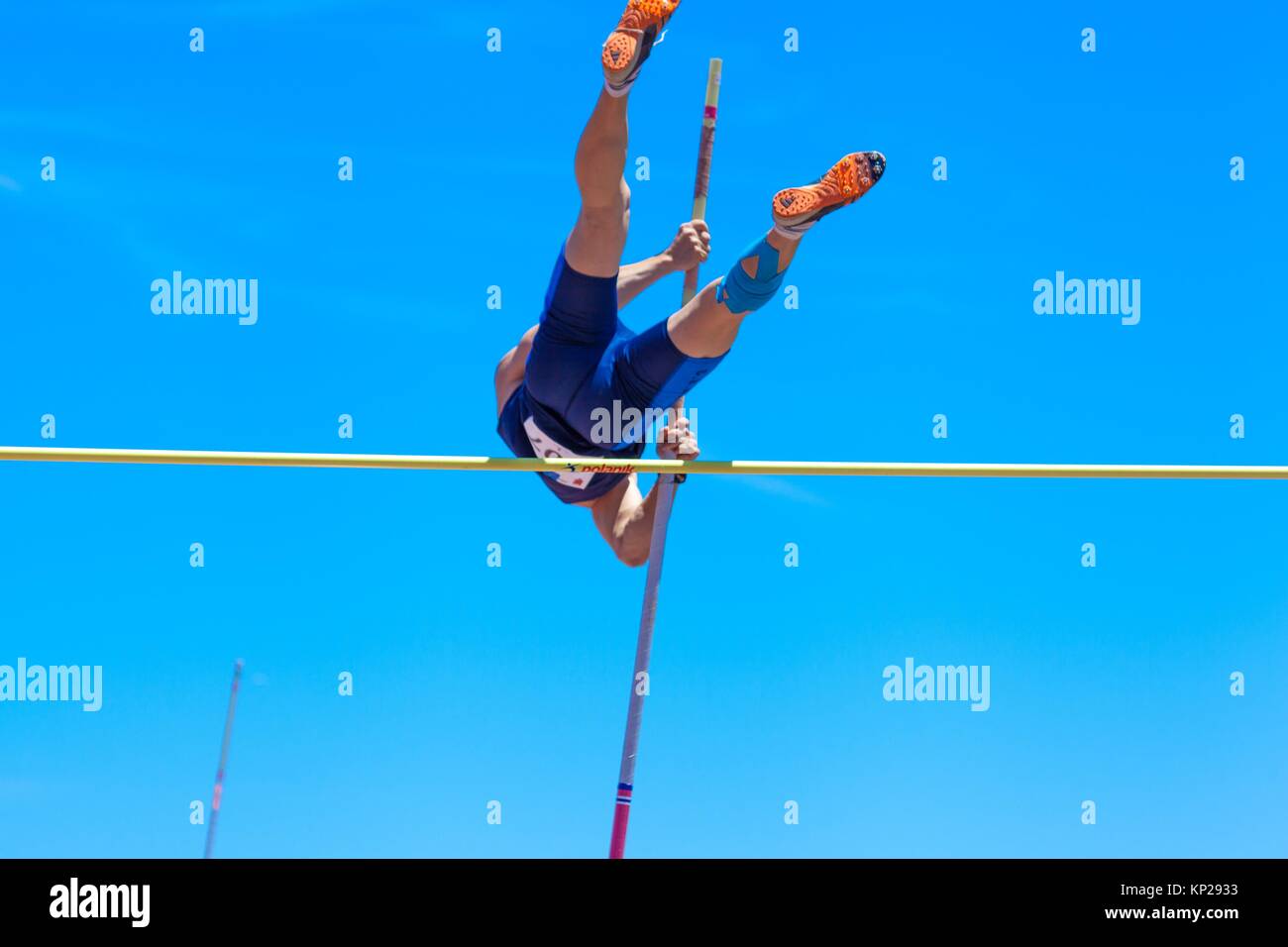 outdooor young adult male pole vaulting competition held 22nd april