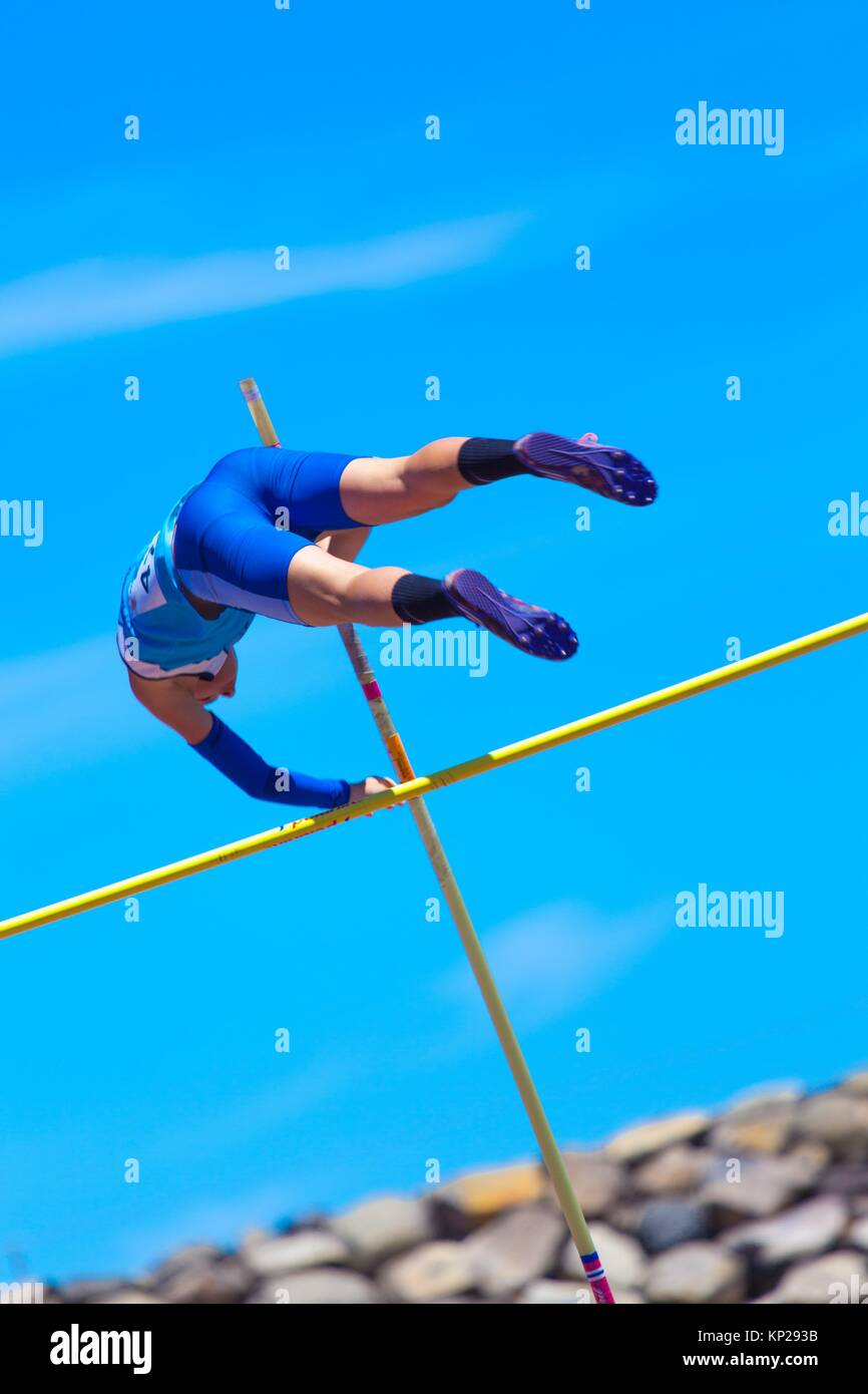 outdooor young adult male pole vaulting competition held 22nd april