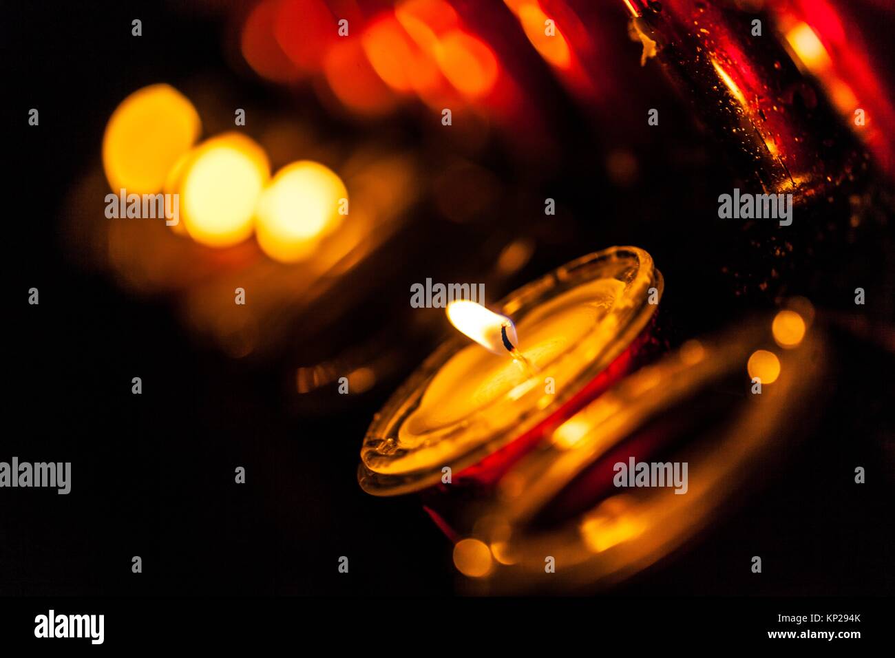 Lit candle set inside a San Cristobal de La Laguna cathedral Stock Photo