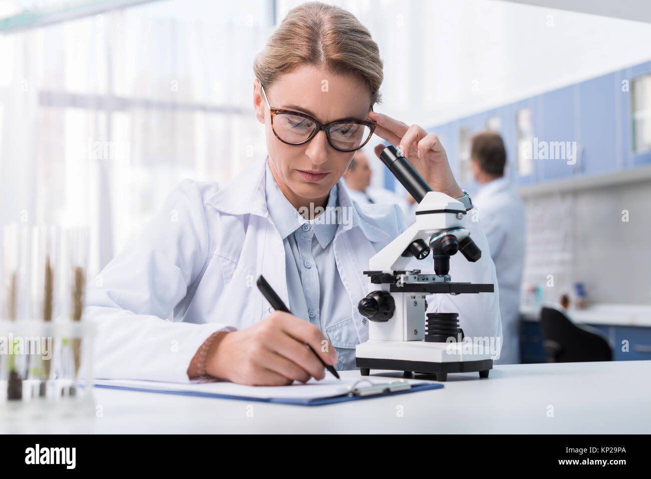 lab technician taking notes Stock Photo Alamy