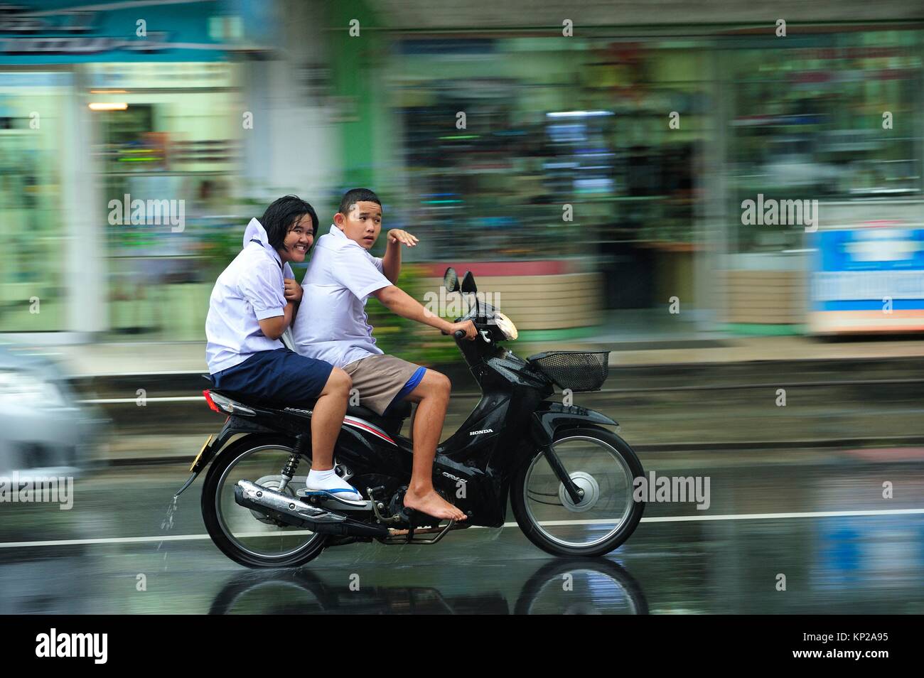 motor scooter on a rainy afternoon in Phangnga, Thailand Stock Photo
