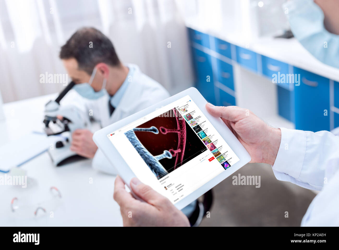 Doctor holding digital tablet Stock Photo - Alamy