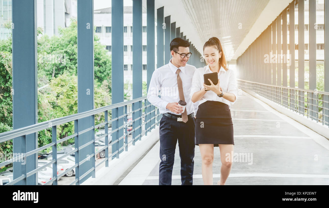 Asian Business people walking and talking outside office Stock Photo ...