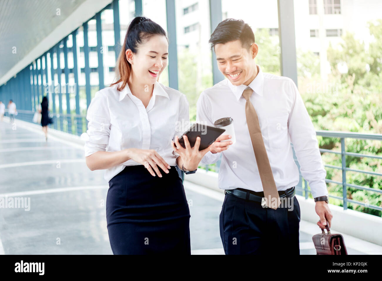 Asian Business people walking and talking outside office Stock Photo ...