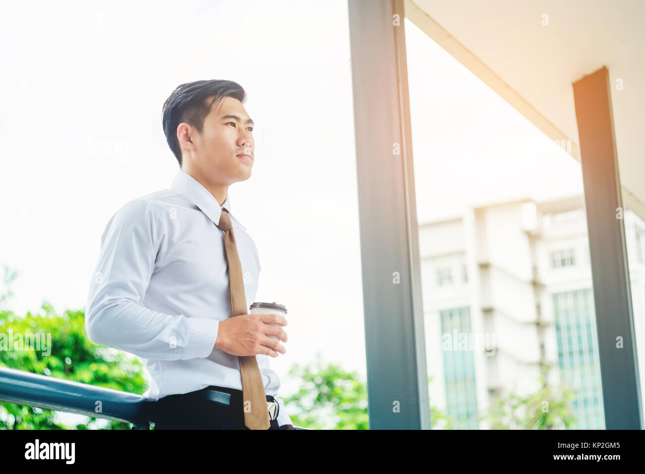 Businessman drinking a coffee and looking view and thinking success ...