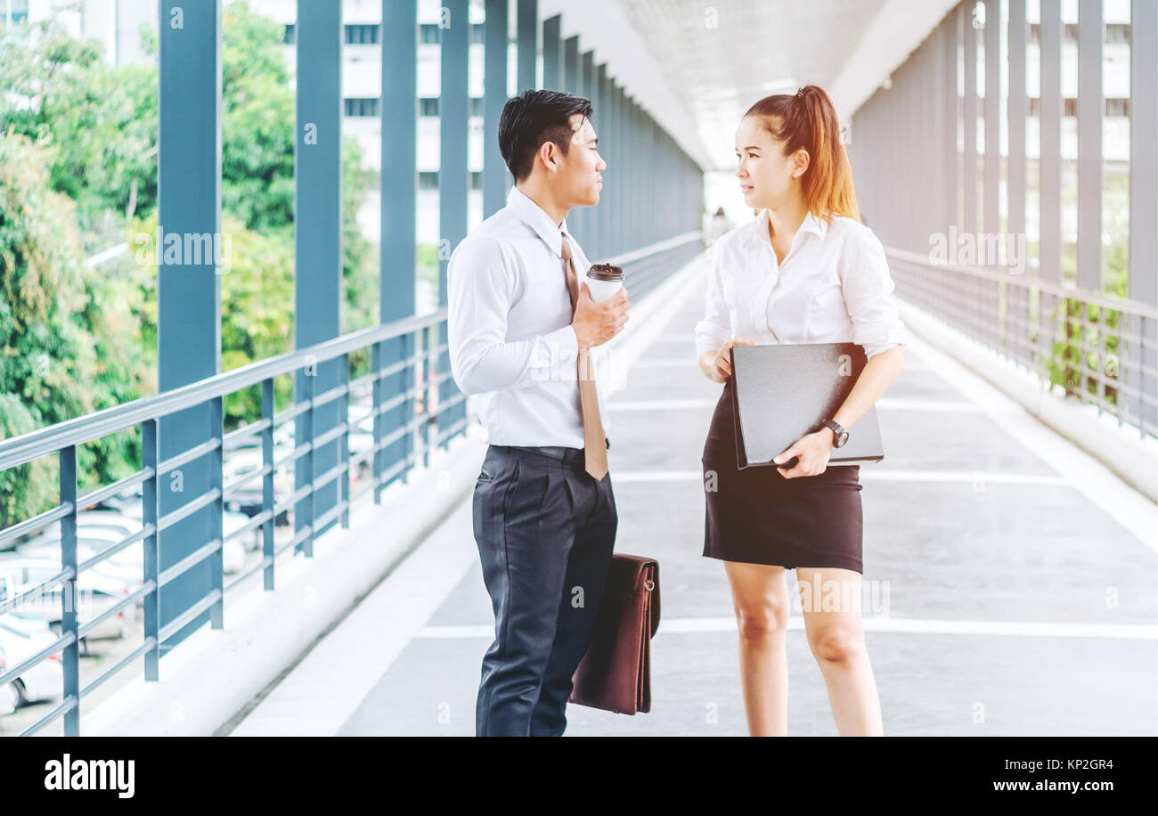 Asian Business people walking and talking outside office Stock Photo ...