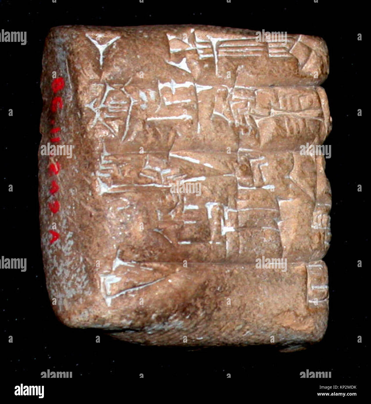 Ancient clay tablet inscribed with cuneiform recording a transaction ...