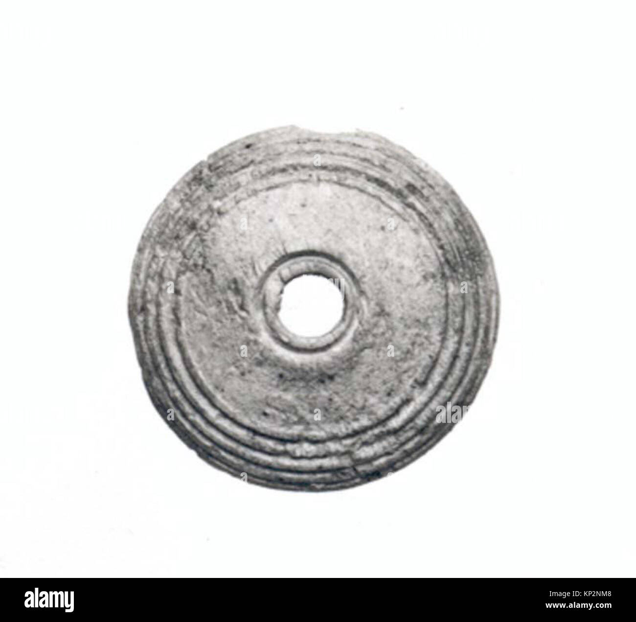 An ancient button from the MET collection, documented in book format ...