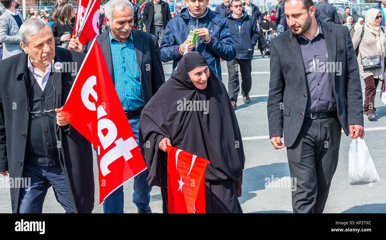 AKP (Justice and Development Party) supporters shout slogans and wave