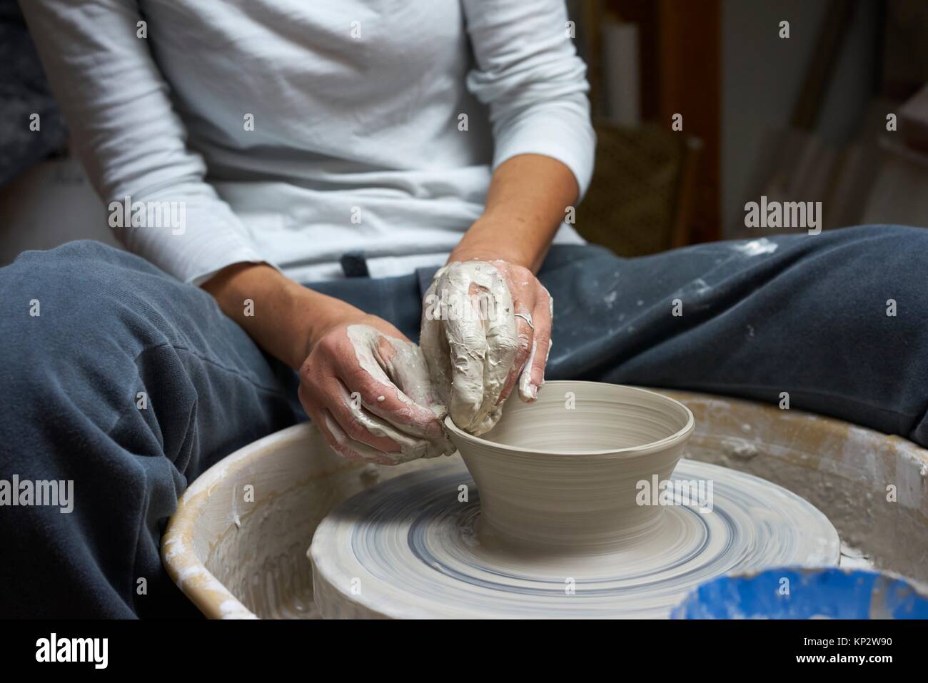 hands of a fervent woman creating pottery. Stock Photo