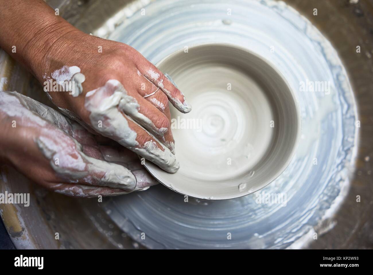 passionate hands creating pottery with natural clay Stock Photo