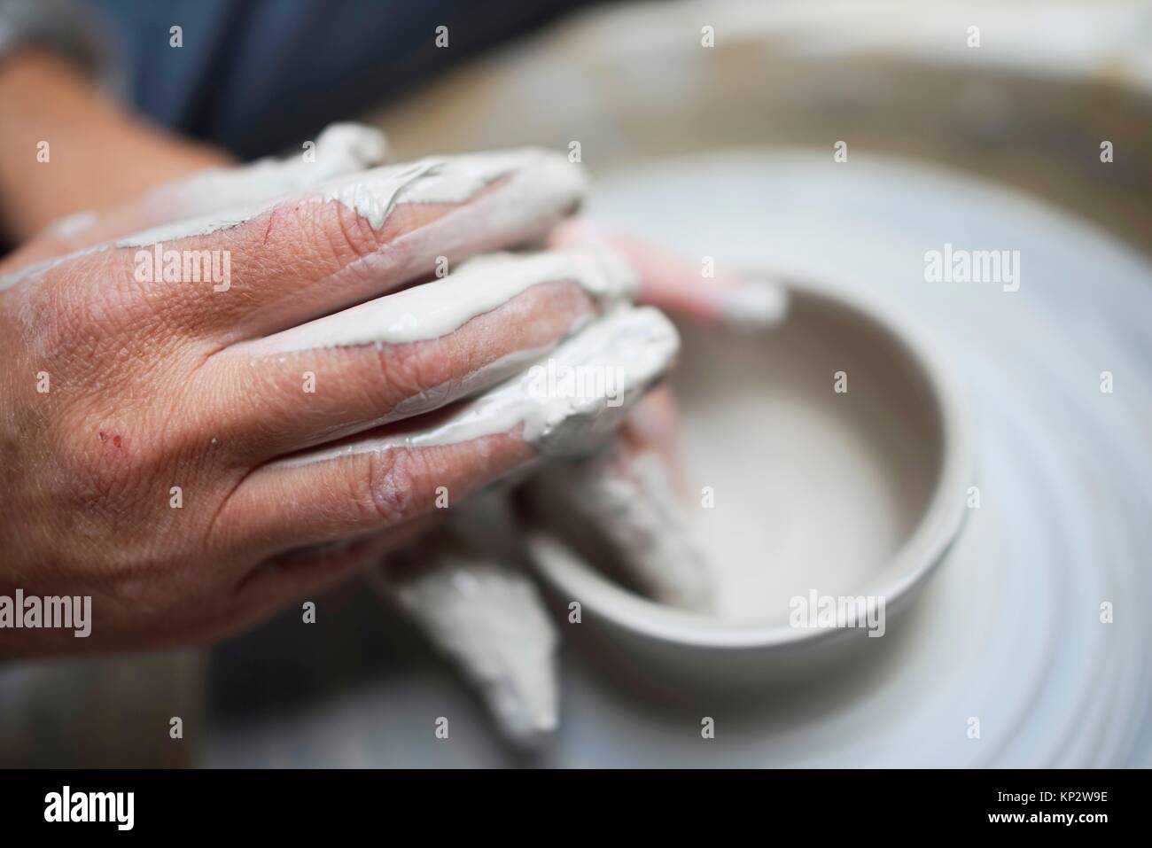 creative hands using clay to create pottery Stock Photo