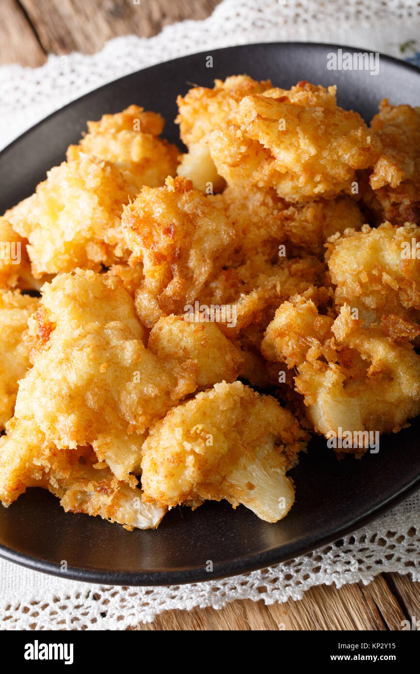 fried cauliflower in breading closeup on a plate. vertical Stock Photo