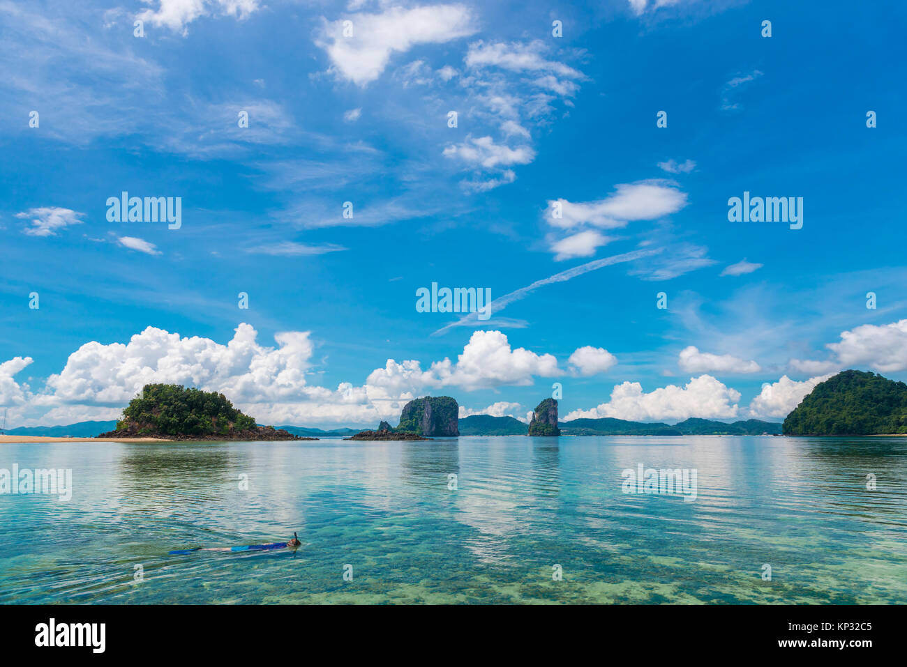 a lone tourist is engaged in snorkeling in the Andaman Sea in Thailand Stock Photo