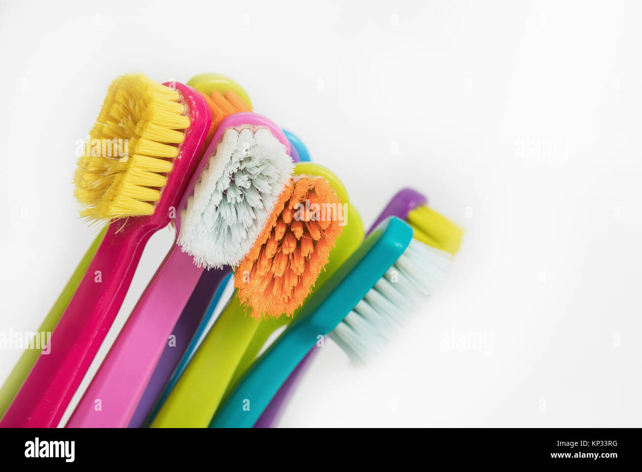 New color ultra fine toothbrushes in colorful glasses. Dental Industry ...