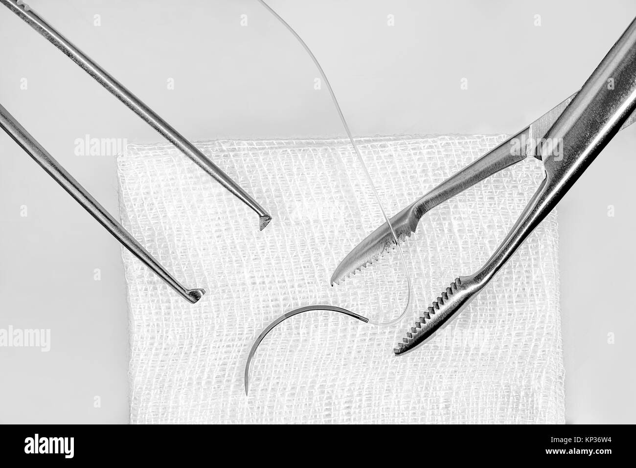 Surgery Forceps And Suture Needle On A Gauze Stock Photo Alamy surgery-forceps-and-suture-needle-on-a-gauze-stock-photo-alamy