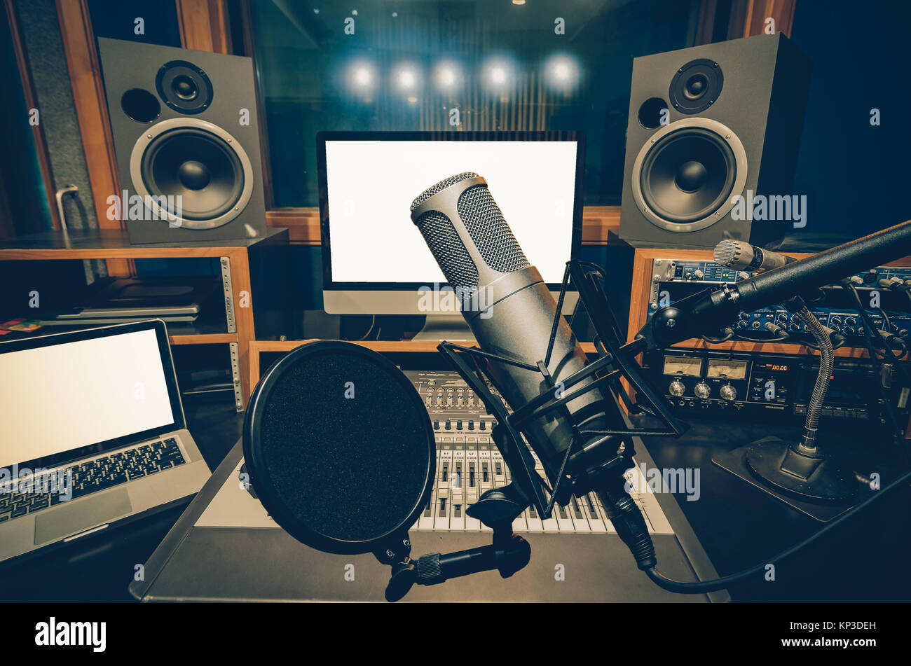 Music studio full of instruments and pc display Stock Photo - Alamy