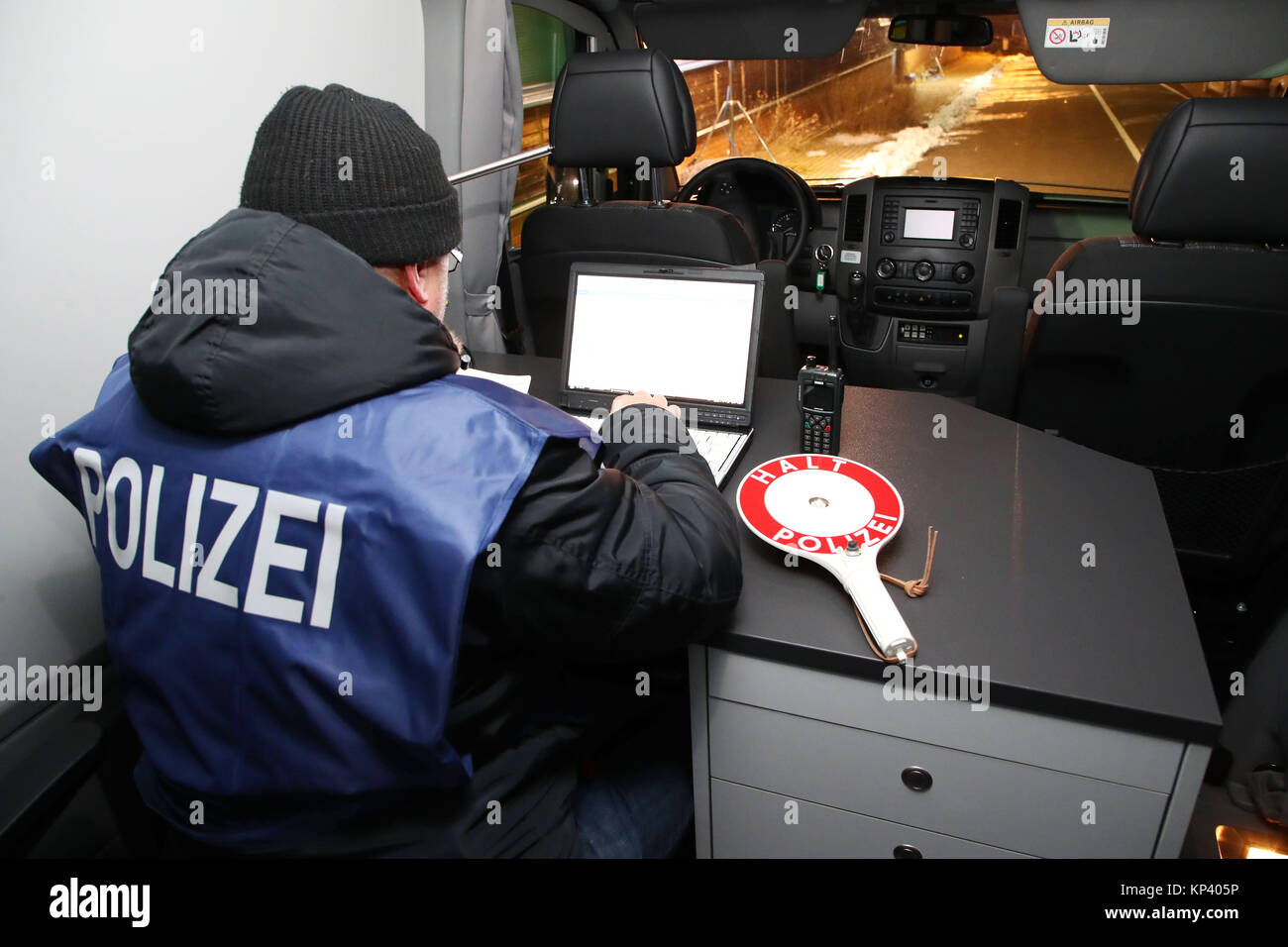 Schoenberg, Germany. 13th Dec, 2017. A police officer checks the ID ...