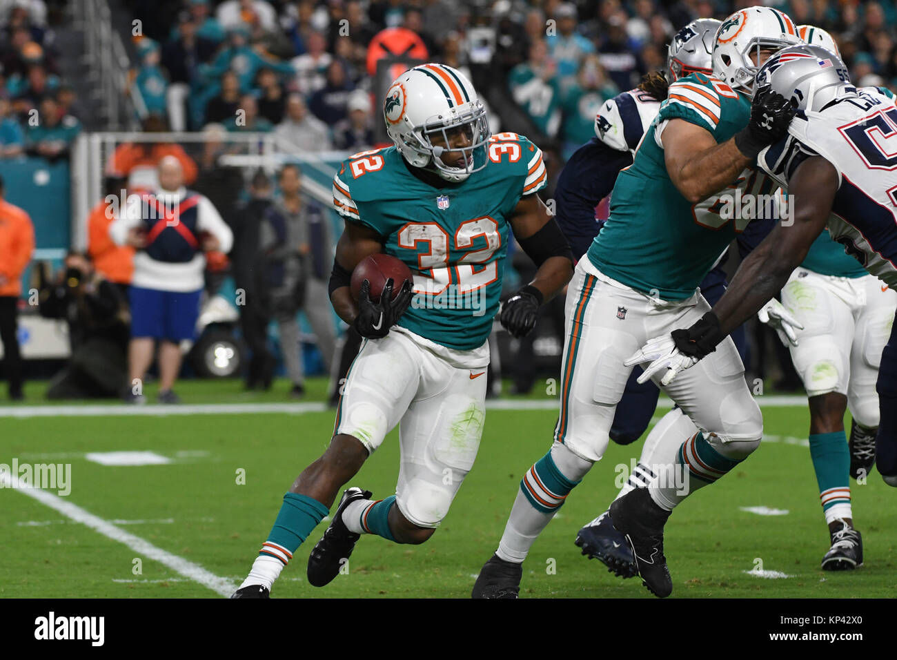 December 11, 2017: Kenyon Drake #32 of Miami in action during the NFL  football game between the Miami Dolphins and New England Patriots at Hard  Rock Stadium in Miami Gardens FL. The