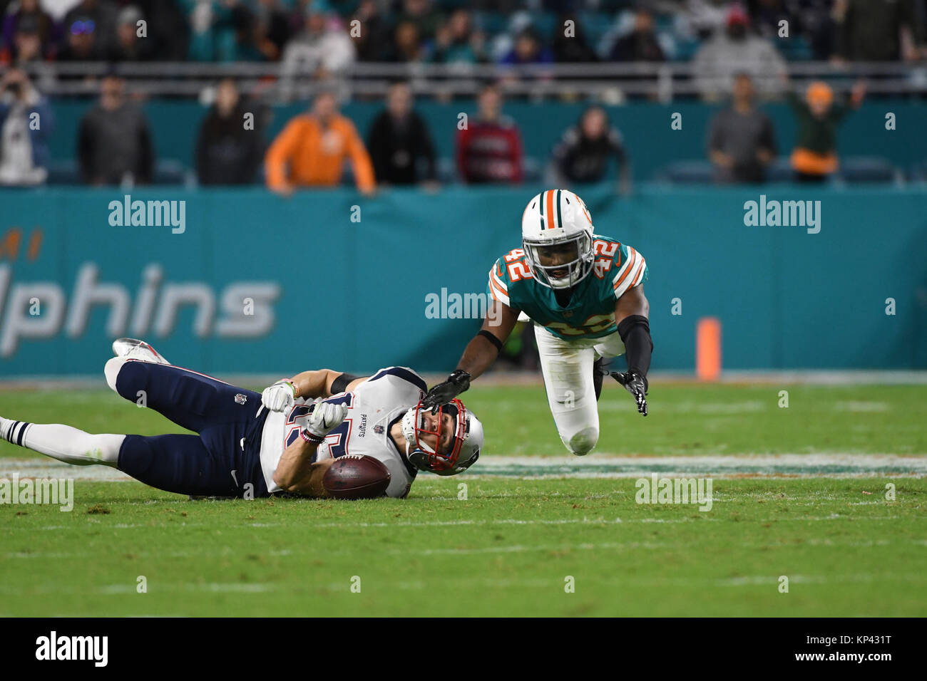 Miami Gardens FL, USA. 11th Dec, 2017. Chris Hogan #15 of New England is defended by Alterraun Verner #42 of Miami during the NFL football game between the Miami Dolphins and New England Patriots at Hard Rock Stadium in Miami Gardens FL. The Dolphins defeated the Patriots 27-20. Credit: csm/Alamy Live News Stock Photo
