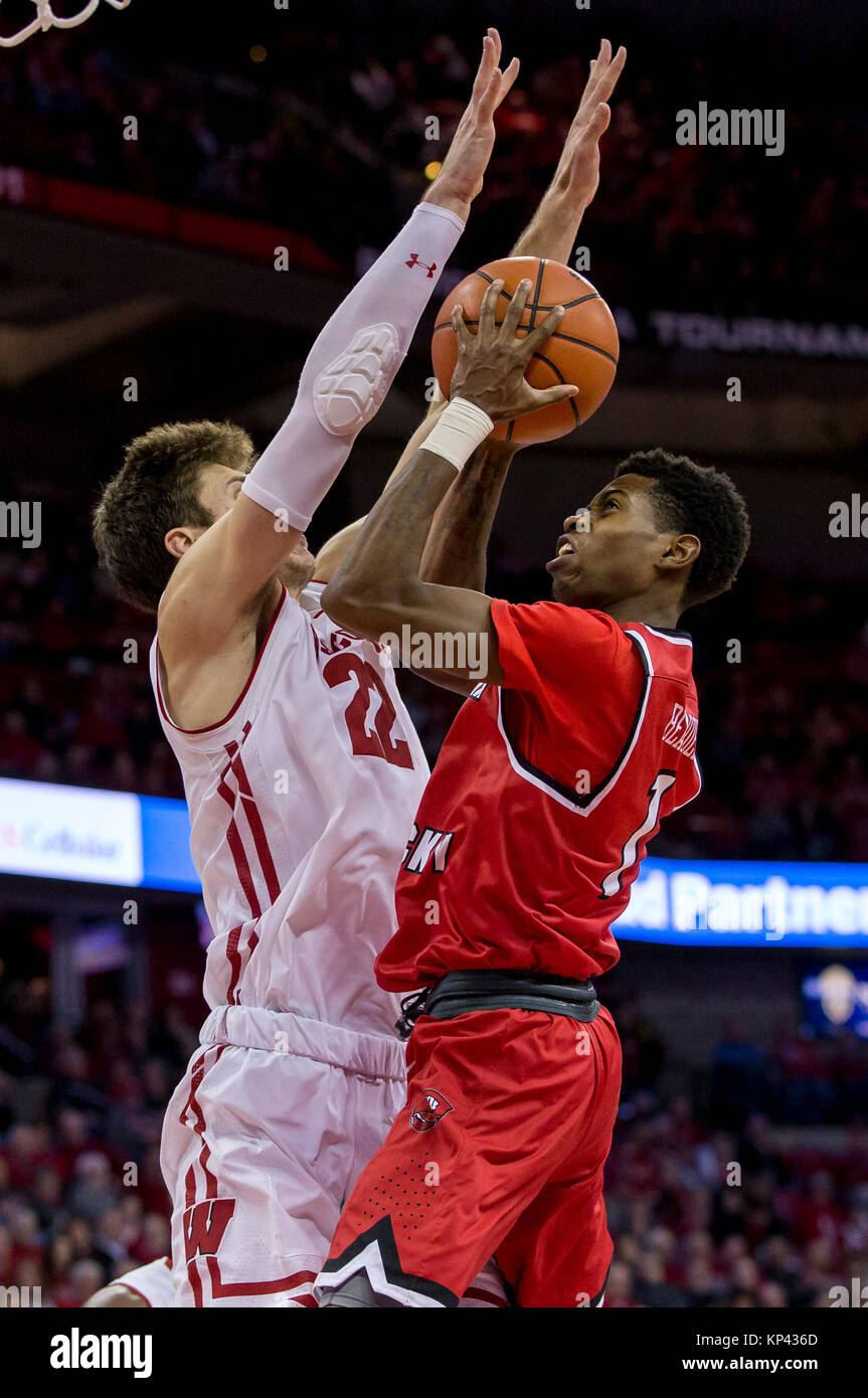 Madison, WI, USA. 13th Dec, 2017. Wisconsin Badgers forward Ethan Happ #22 blocks the shot of Western Kentucky Hilltoppers guard Lamonte Bearden #1 during the NCAA Basketball game between the Western Kentucky Hilltoppers and the Wisconsin Badgers at the Kohl Center in Madison, WI. Wisconsin defeated Western Kentucky 81-80. John Fisher/CSM/Alamy Live News Stock Photo