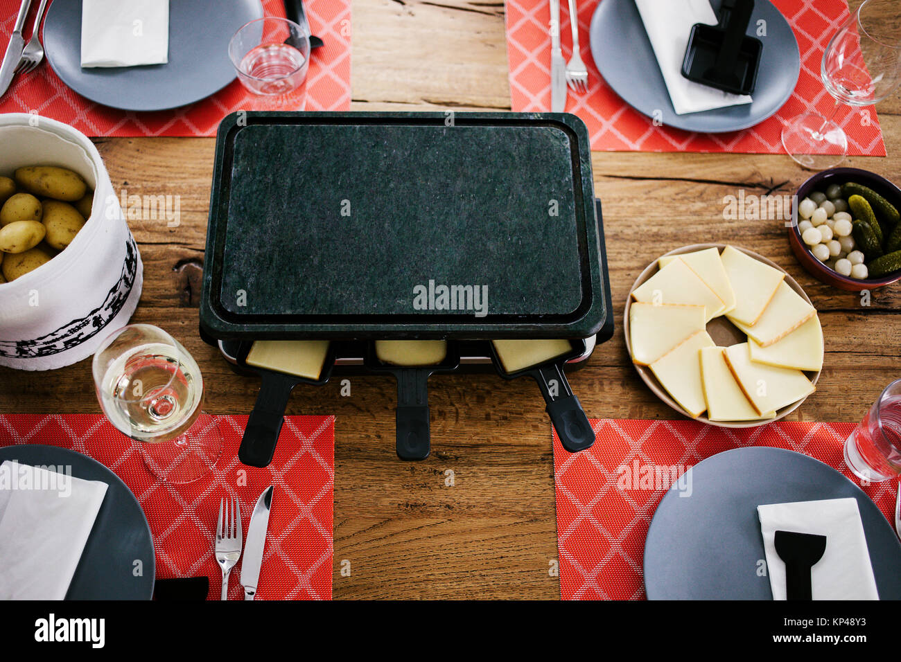 Swiss traditional dish called raclette including steamy potatoes