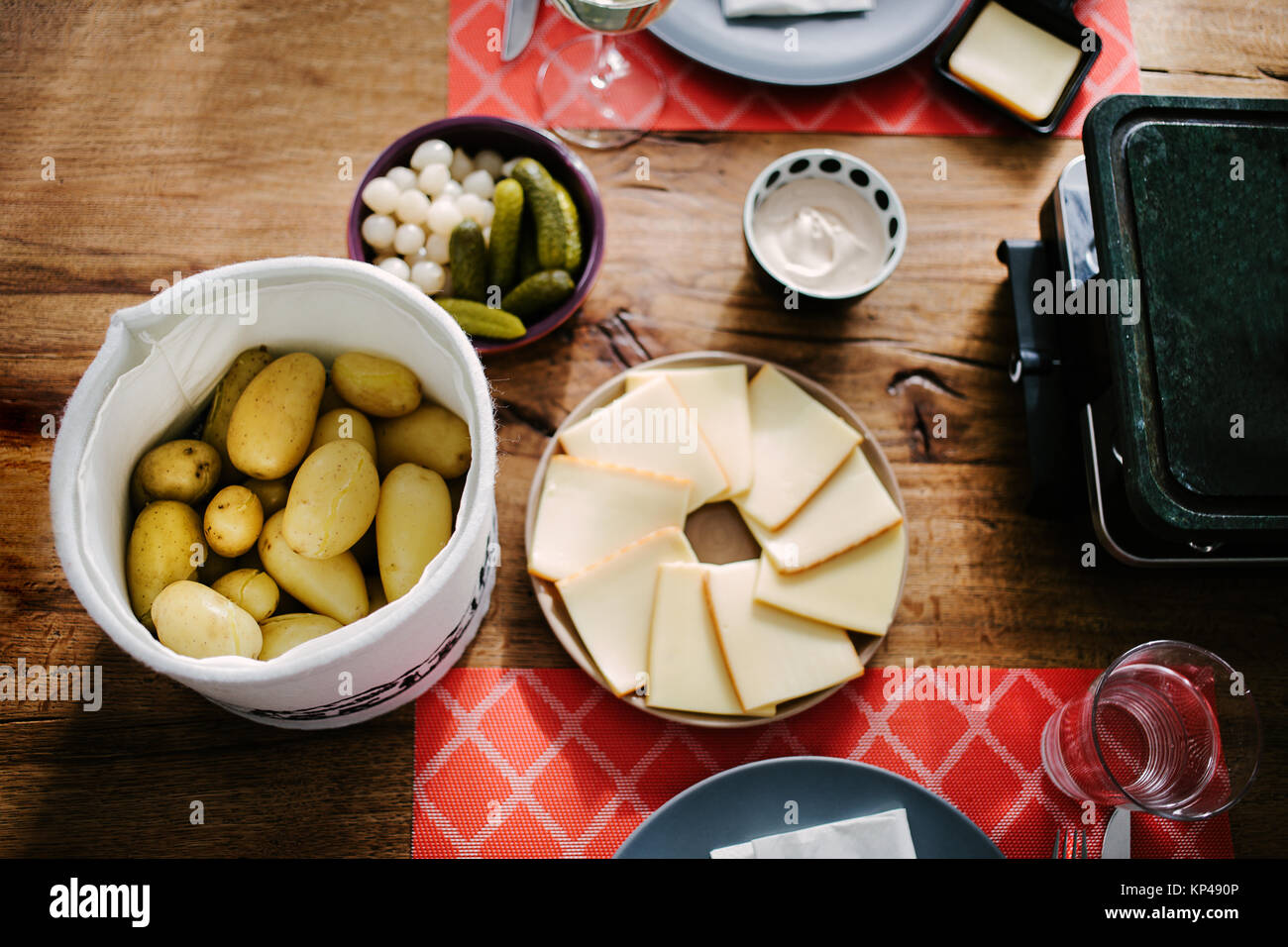 Swiss traditional dish called raclette including steamy potatoes