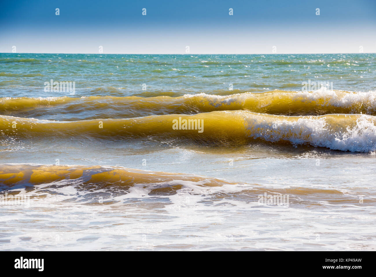 Small waves at the beach of Spain Stock Photo