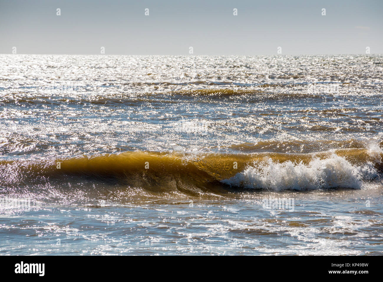 Small waves at the beach of Spain Stock Photo