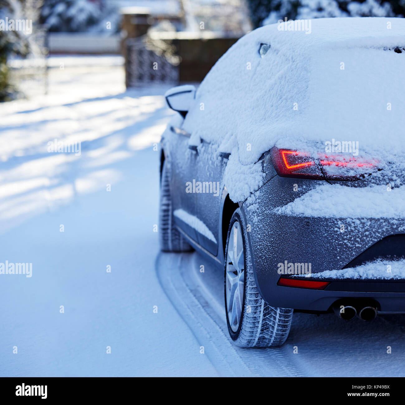 Snow covered car in winter conditions Stock Photo