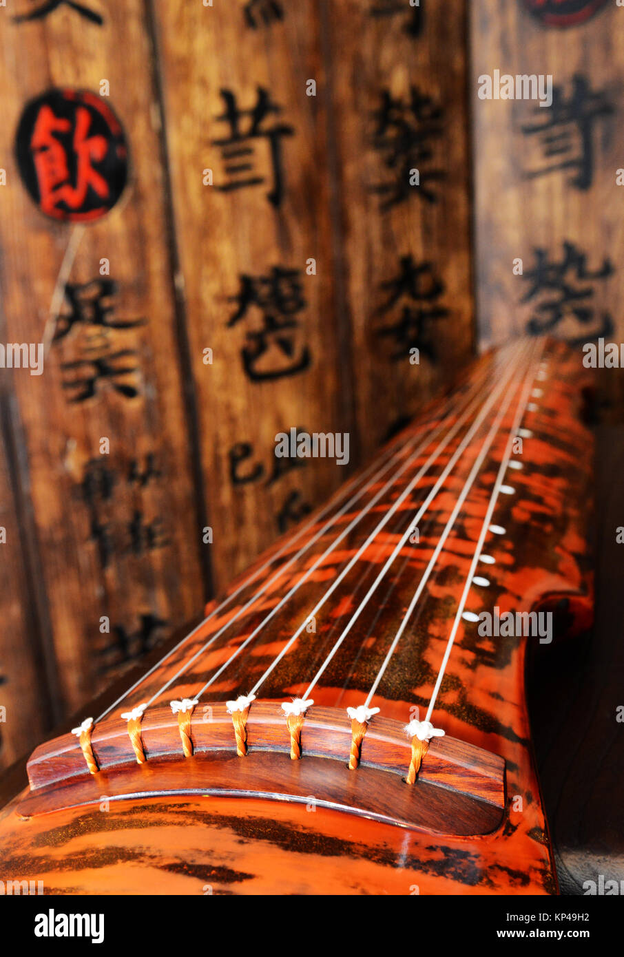 Guqin is a traditional Chinese musical string instrument. Stock Photo