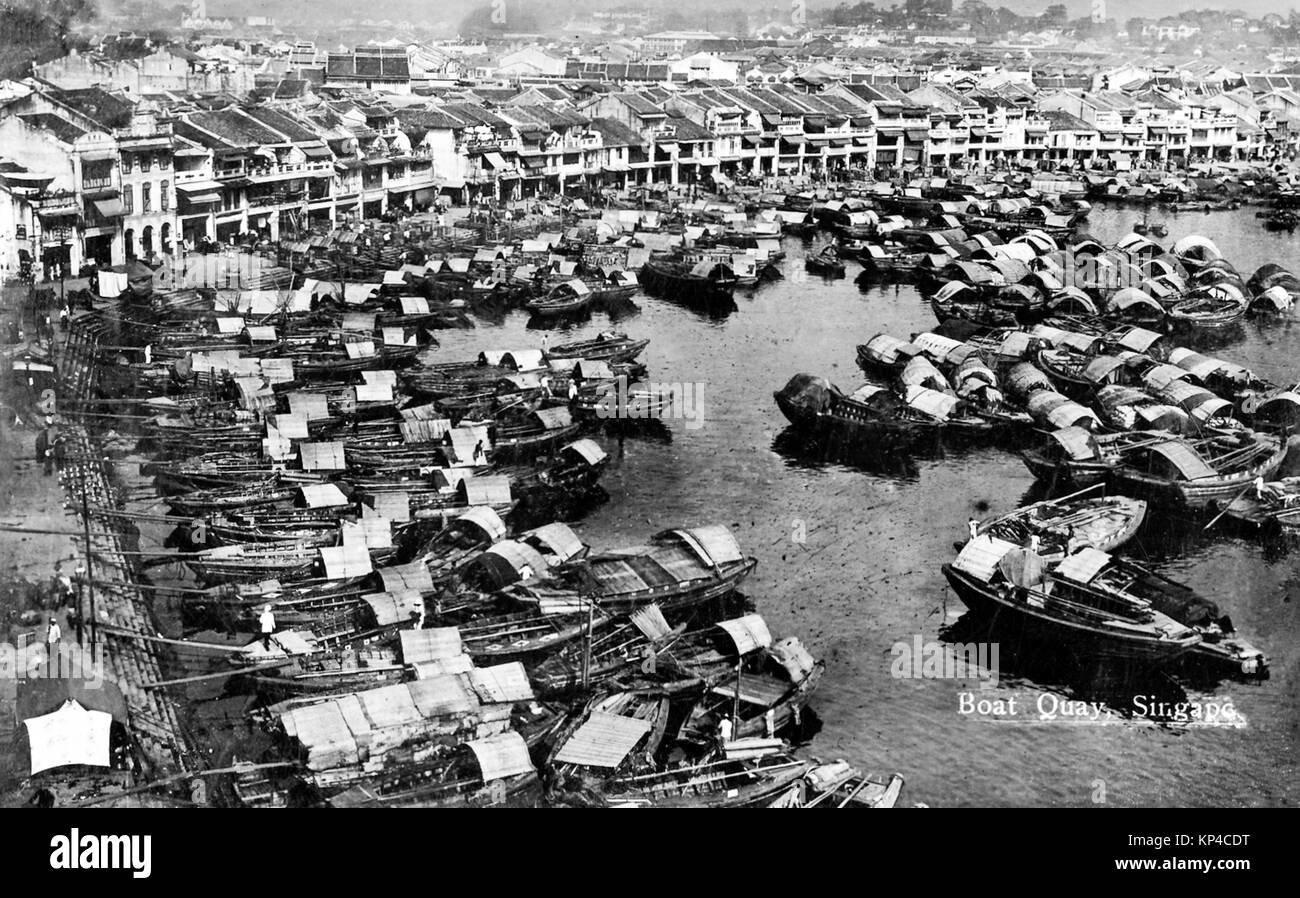 Boat Quay on the southern bank of the Singapore River, British Malaya circa 1920. The quay was completed in 1842 and was at the heart of the river trade until the 1960s. Stock Photo