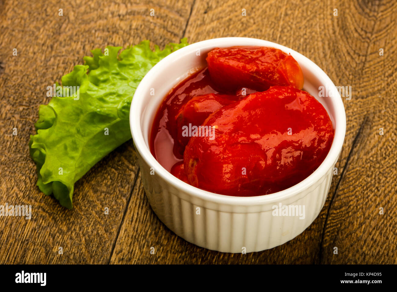 Peeled tomatoes with juice in the bowl Stock Photo Alamy