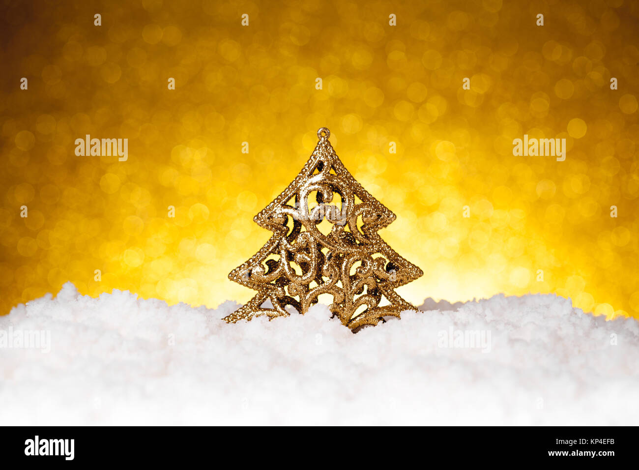 Golden christmas fir tree decoration on glitter background Stock Photo ...