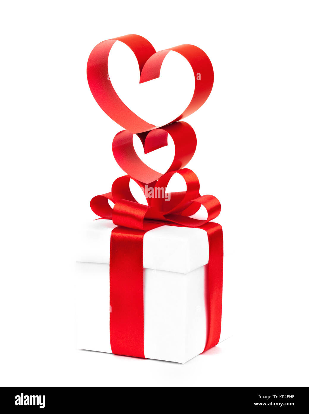 holiday gift box with red ribbon in the shape of a heart isolated on ...