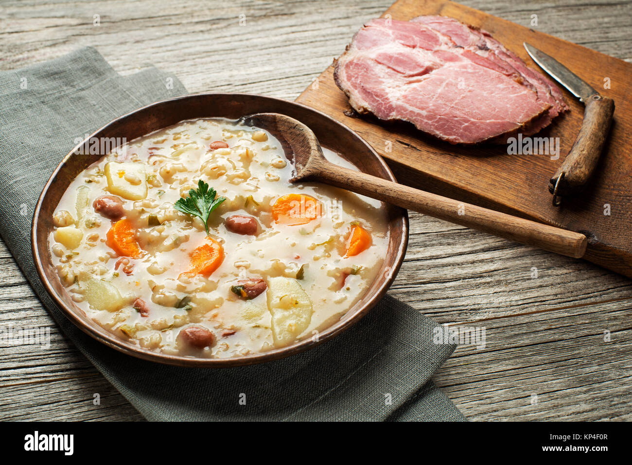 Barley porridge boiled with beans potato and carrot Stock Photo