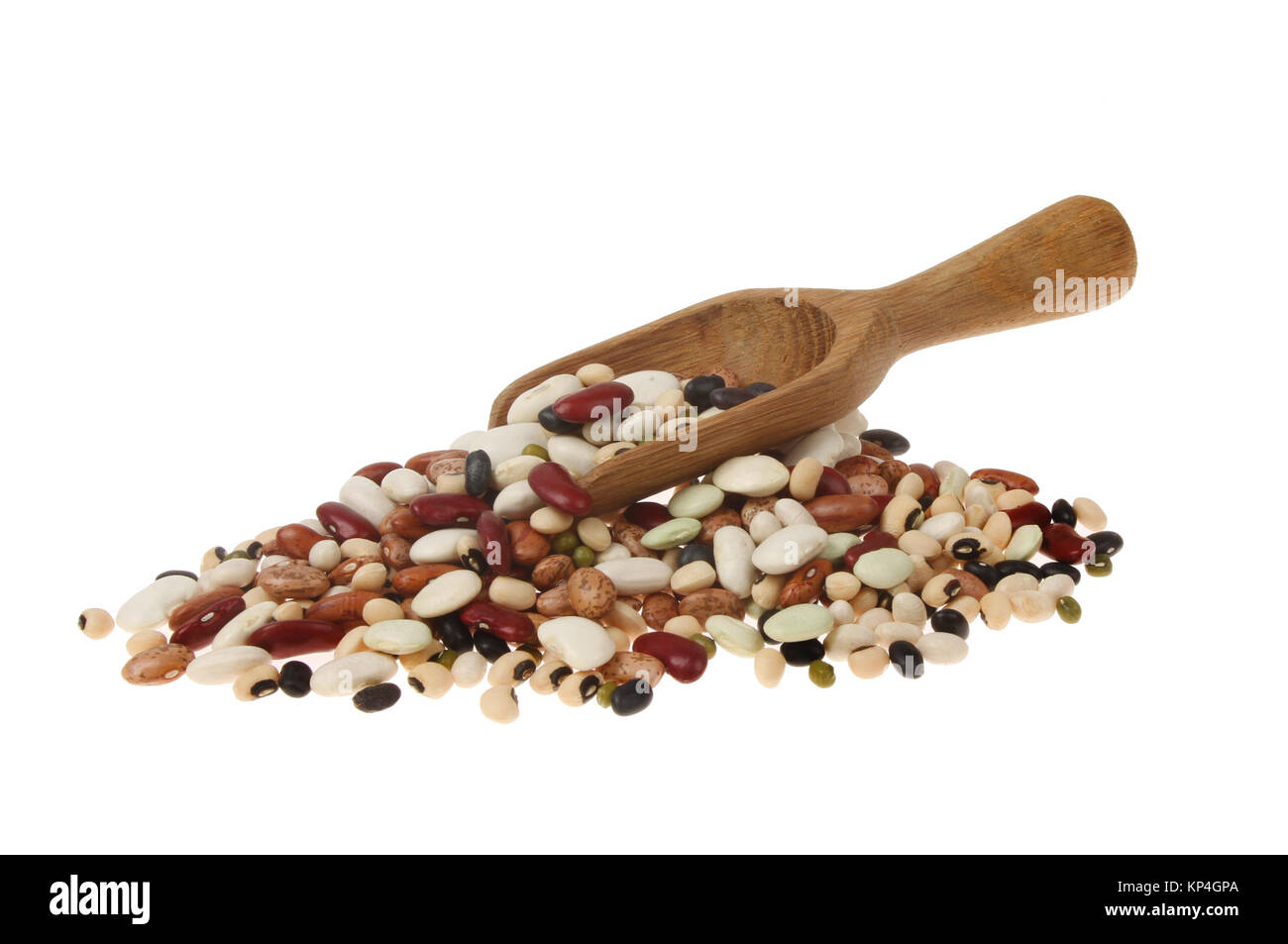 Pile of ten dried beans with a wooden scoop isolated against white Stock Photo
