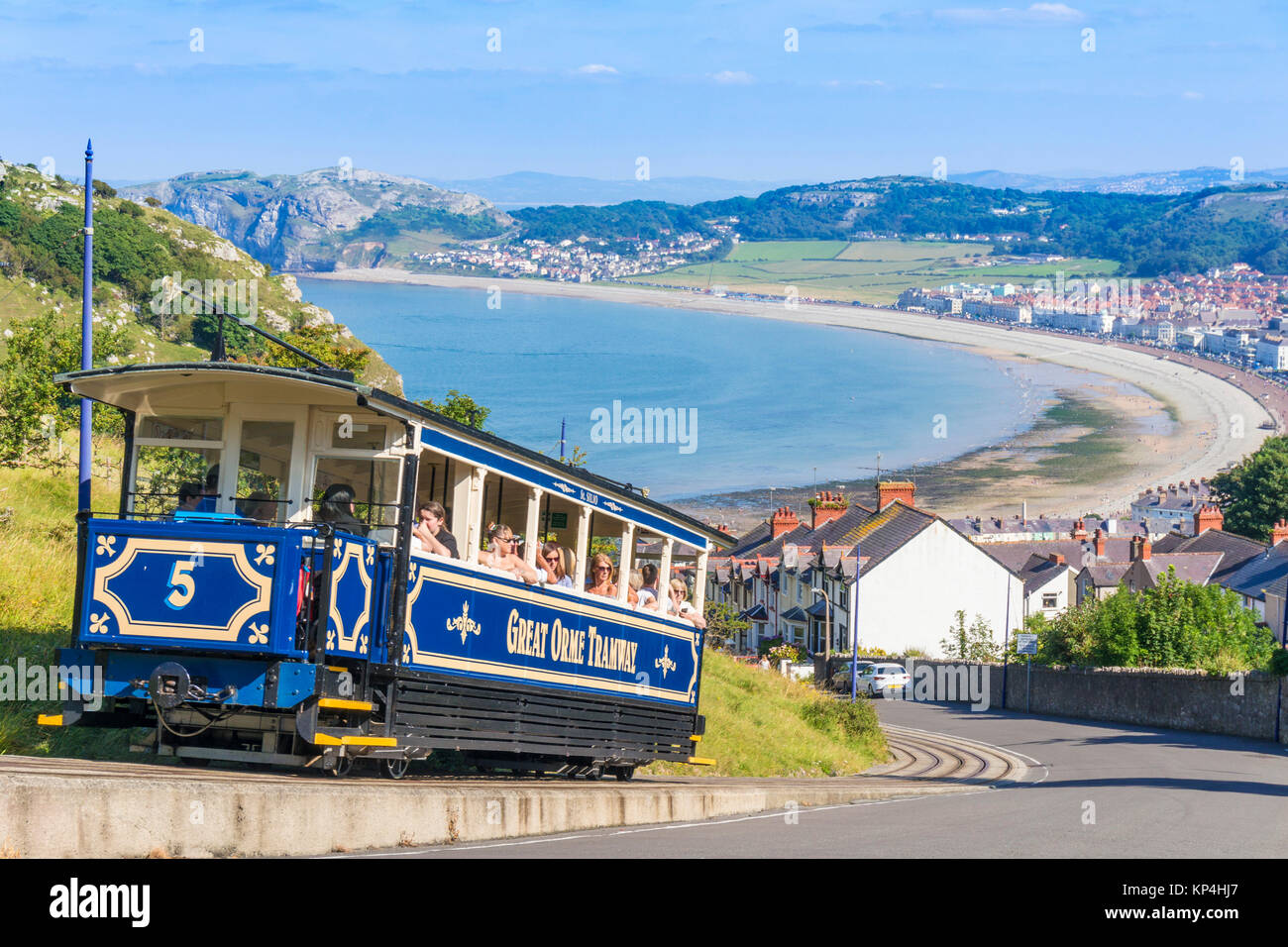 north wales llandudno north wales Llandudno view of Llandudno bay with tram train of the great orme tramway going up the great Orme headland gwynedd Stock Photo