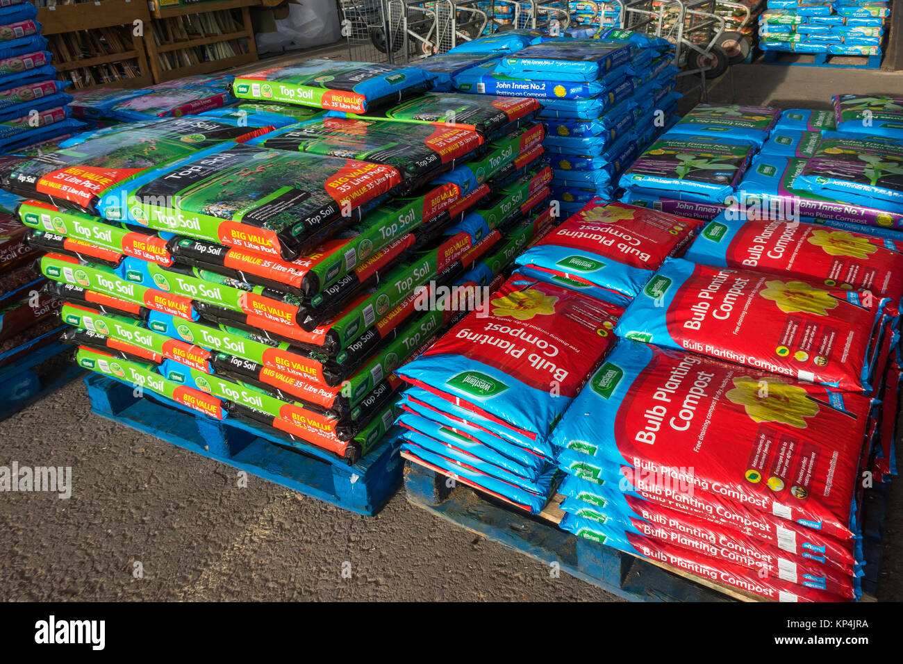 Stacks of bags of Top Soil, bulb planting compost and John Innes