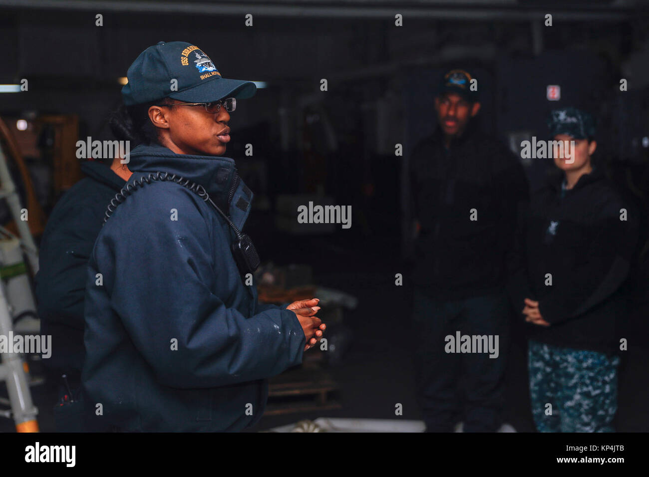 Boatswain’s Mate 3rd Class Raiona Briscoe shares line handling safety instruction with other