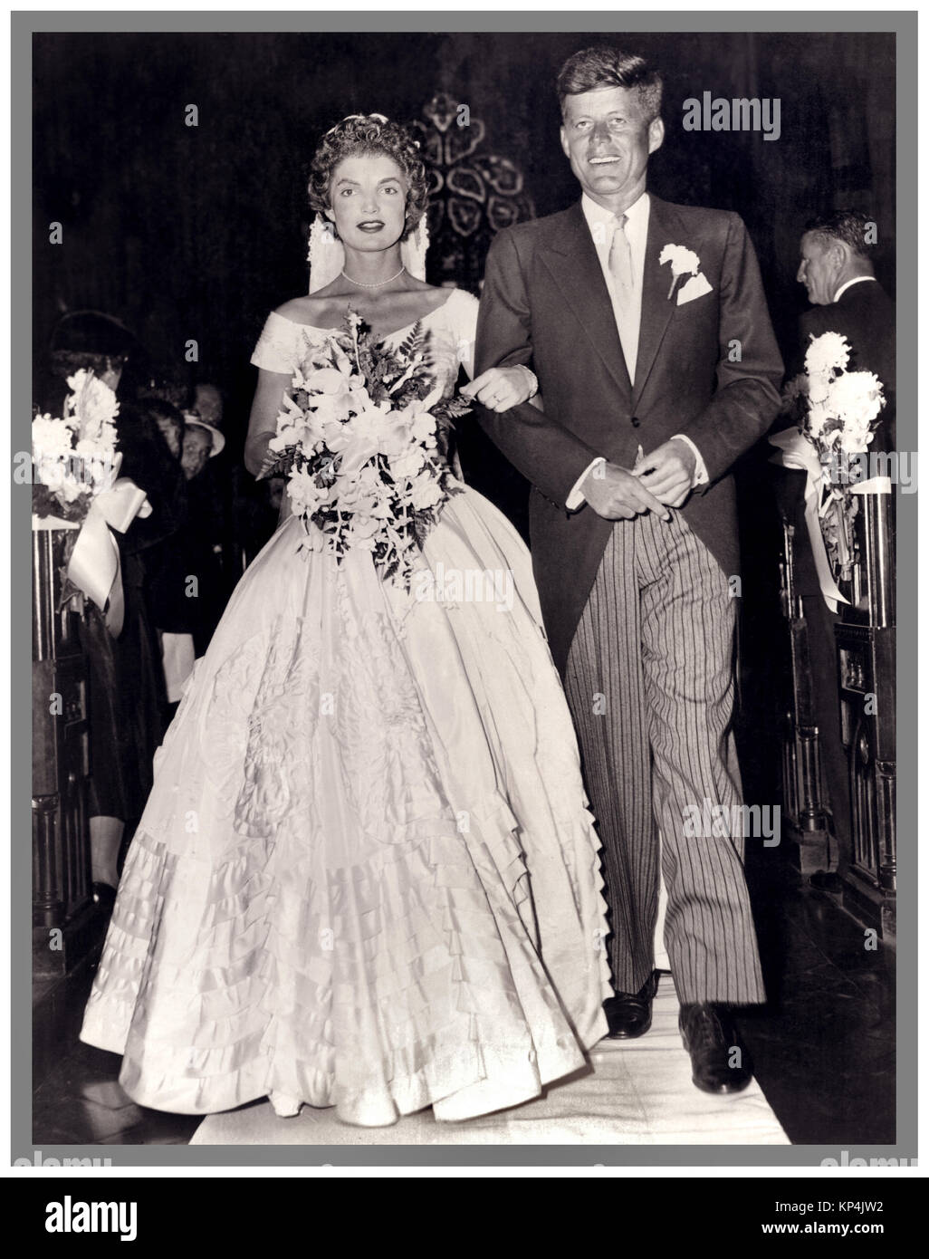 JFK KENNEDY WEDDING 1953 Vintage B&W  image of the Jackie Kennedy marriage to J.F Kennedy in 1953 Sept 12th.St. Mary’s Church Newport in a dress made by New York dressmaker Ann Lowe. Stock Photo