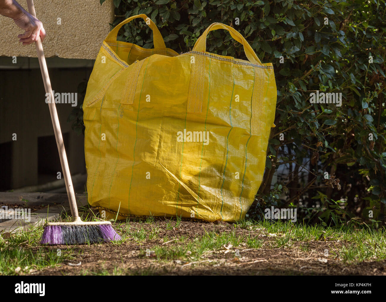 Street cleaning, cleaning in the garden - broom, trash bag Stock Photo