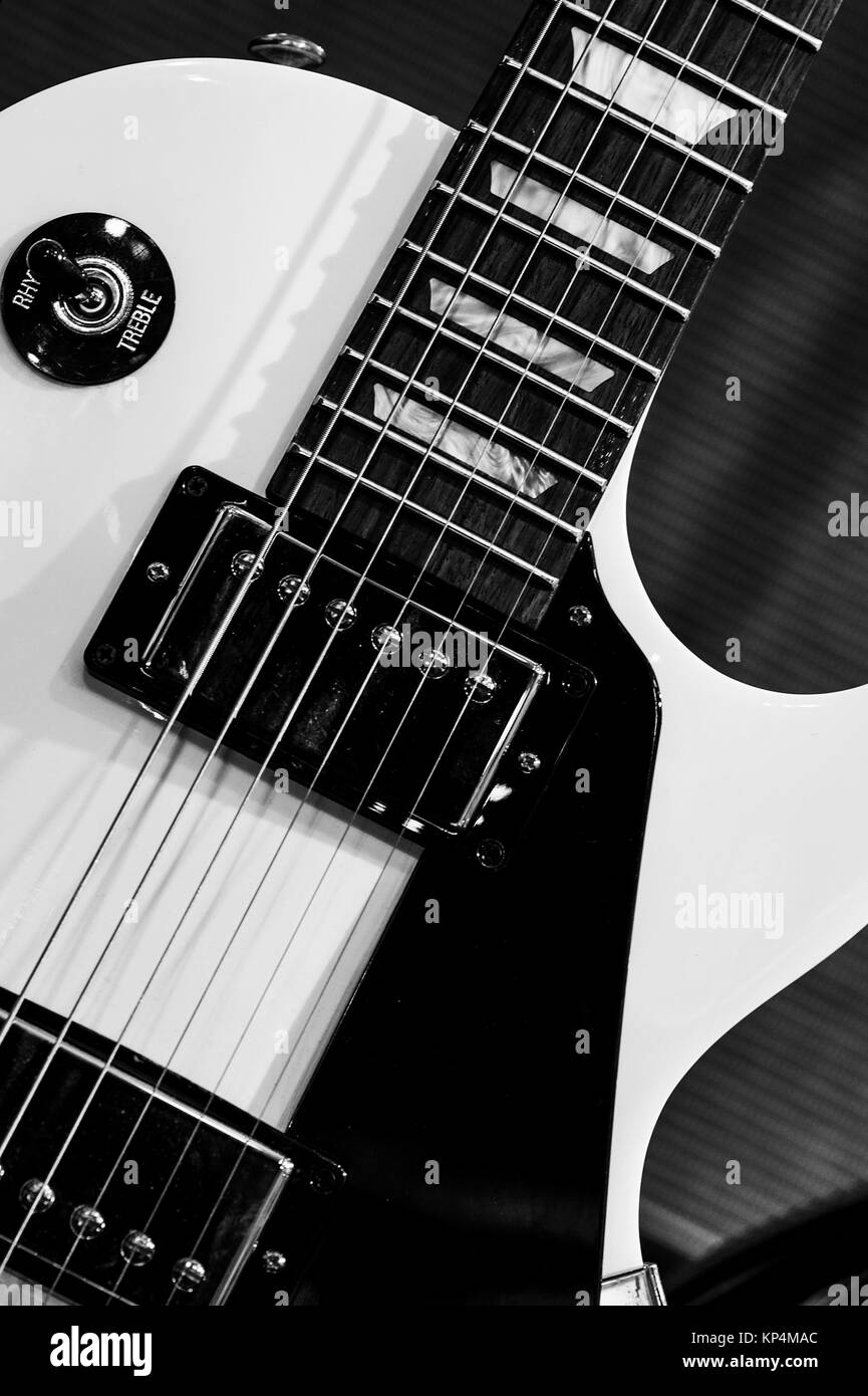 Close Up of a White Electric Steel String Guitar Stock Photo