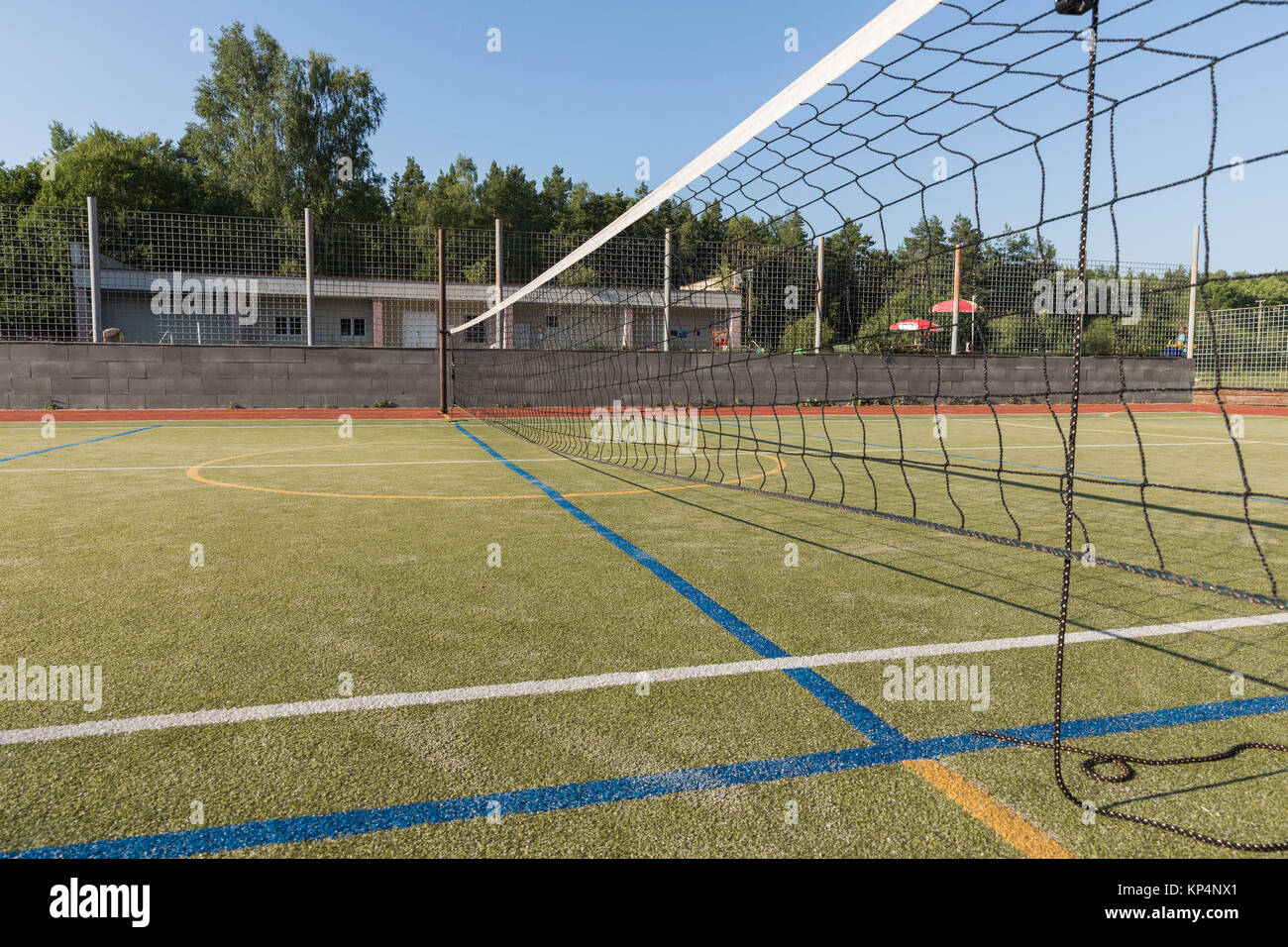 Outdoor playground for tennis, volleyball and football. Net on the  playground Stock Photo - Alamy