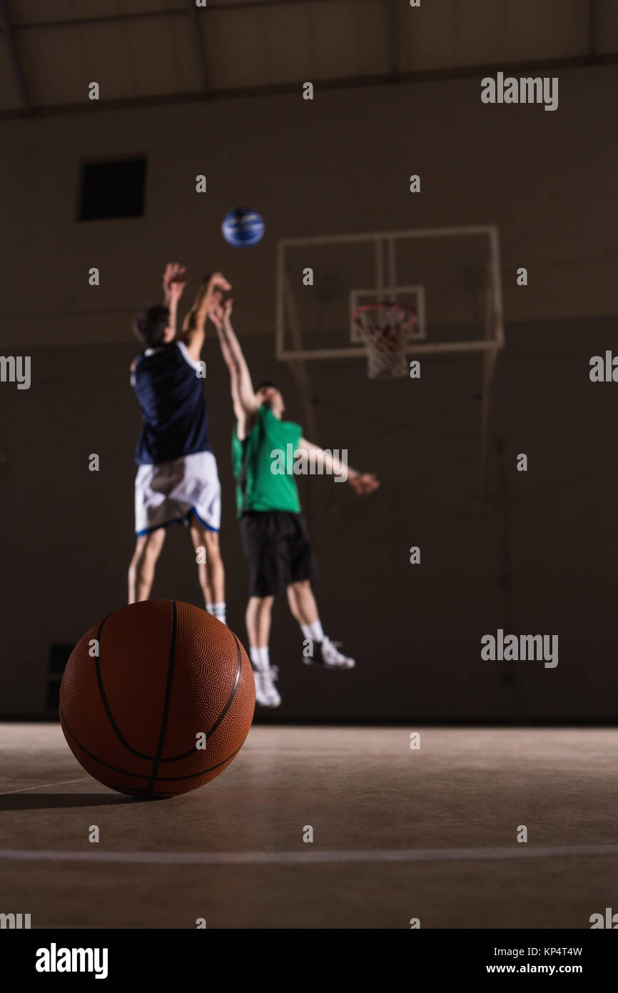 Two players playing basketball in the court Stock Photo - Alamy