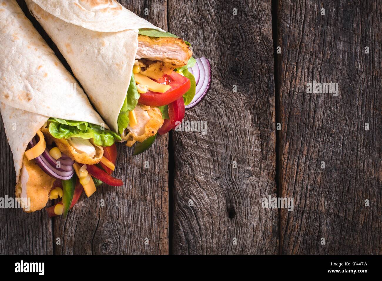 Tortilla sandwiches with fried chicken Stock Photo Alamy