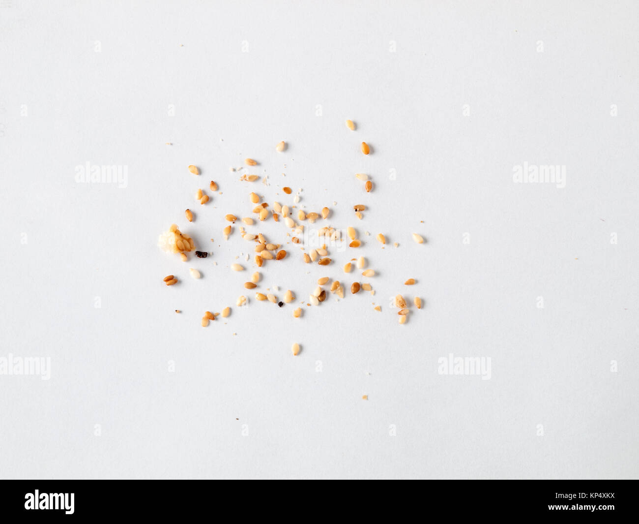 Scattered sesame seeds and crumbs isolated on white background Stock Photo Alamy